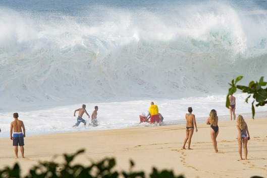 Lifeguards making a rescue on beach