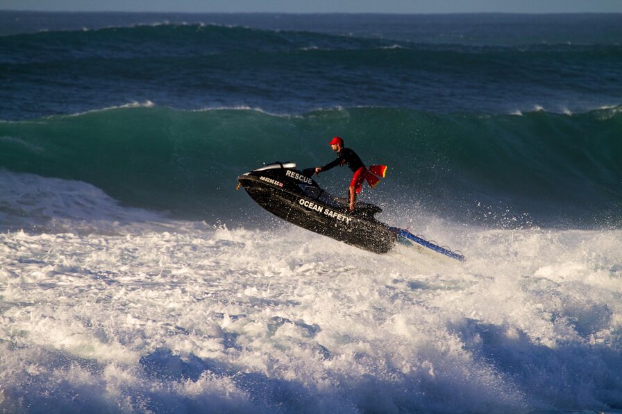 Lifeguard on a ski in ocean